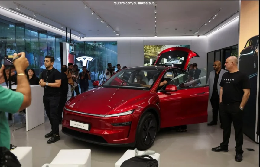 Tesla Model Y displayed at official launch in India showroom, showcasing sleek design and premium EV features at ₹59.89 Lakh.